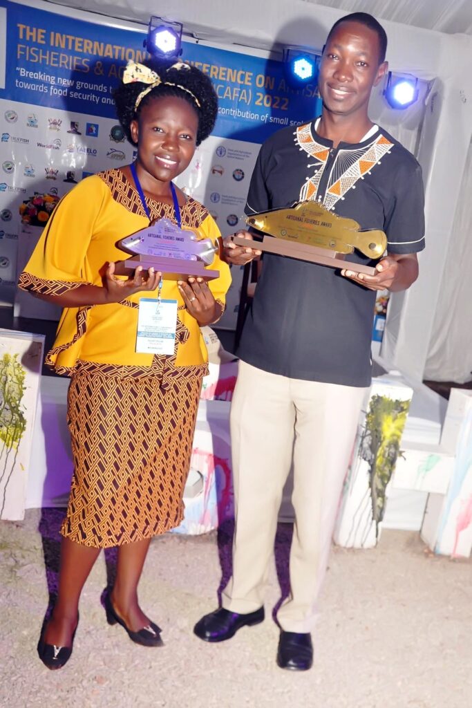 Julliet Nafula Ogubi (L) and Herbert Nakiyende (R) with their awards at the conference.