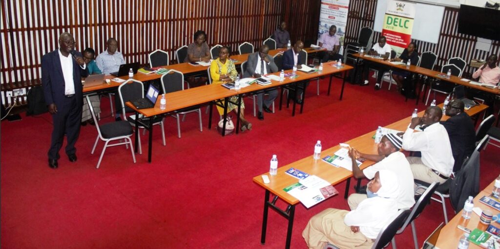 Dr. John Sentongo (Standing) makes a presentation on the system. 