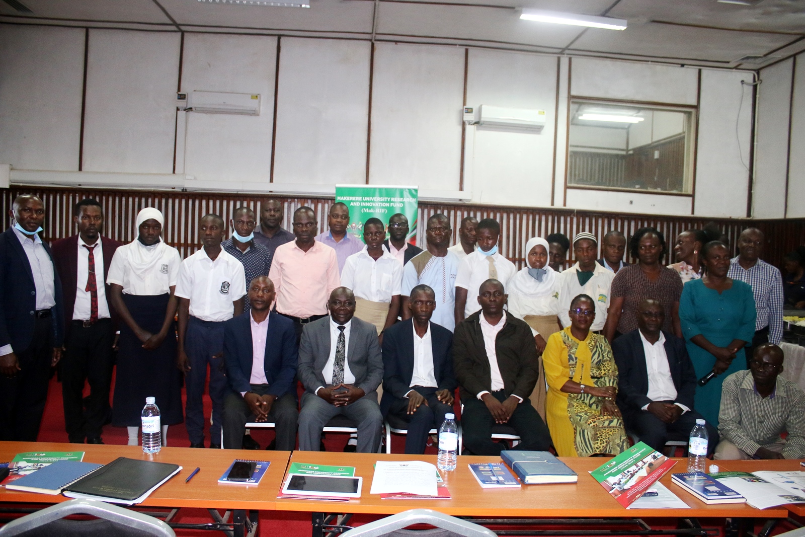 The Principal CEES, Prof. Anthony Muwagga Mugagga (Seated 3rd L) and Dr. John Sentongo (Seated R) with members of the research team and participants at the dissemination on 30th August 2022, Makerere University.