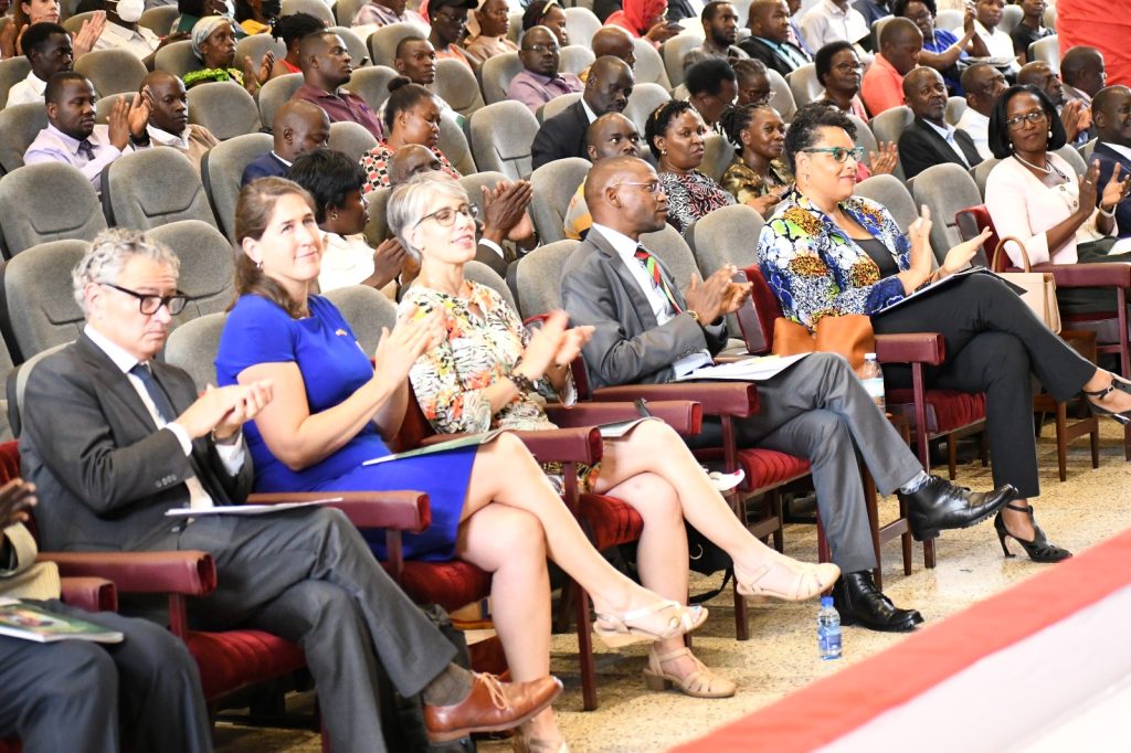 H.E. Natalie Brown, dignitaries and part of the audience applaud during the proceedings. 