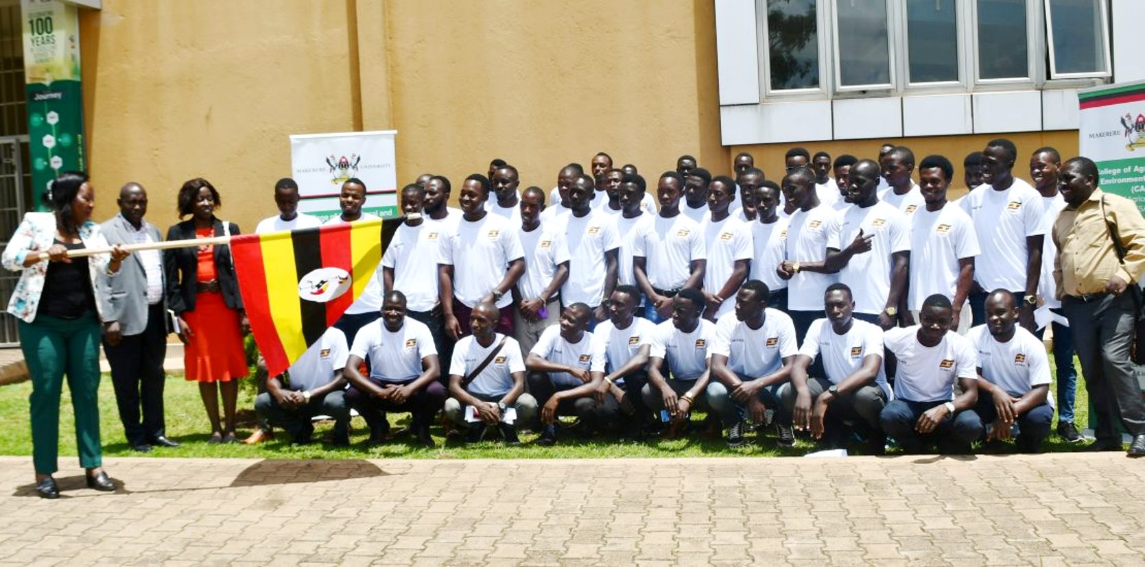 The Principal, College of Agricultural and Enviromental Sciences (CAES), Prof. Gorretie Nabanoga (Left) flags off the student interns on 21st September 2021, Frank Kalimuzo Central Teaching Facility, Makerere University.