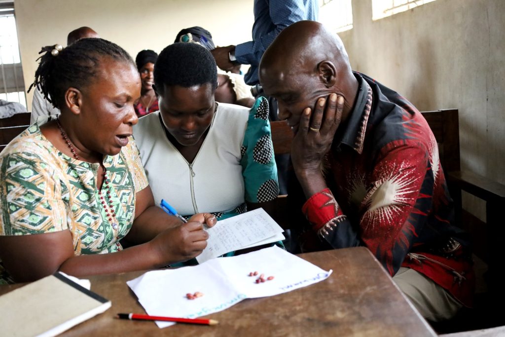 Dr. Florence Kyazze (Left) interacting with farmers during the meeting at Nambaale Sub-county.