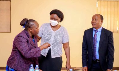The Director of Culture at the Ministry of Gender, Labour and Social Development, Ms. Juliana Naumo Akoryo (Centre) and Dr. Godfrey Siu, the Principal Investigator from Mak-CHDC (Right) interact with a participant at the workshop on 22nd July 2022, Kampala.