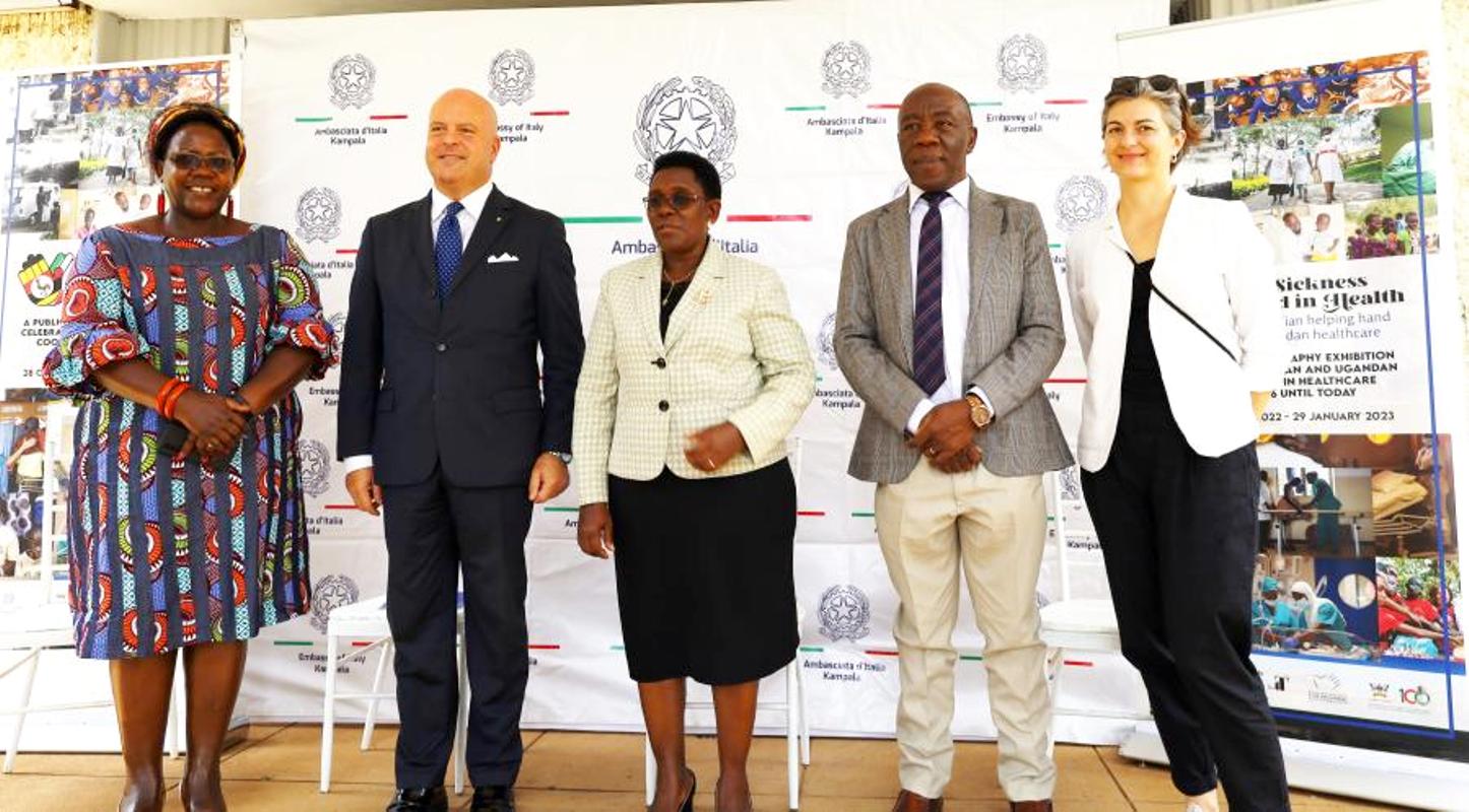 The Minister of State for Public Service Hon. Grace Mary Mugasa (Centre), Ambassador of Italy to Uganda H.E. Massimiliano Mazzanti (2nd Left), DVCFA Prof. Henry Alinaitwe (2nd Right), Principal CHUSS Prof. Josephine Ahikire (Left) and an Italian Official pose for a group photo at the “In Sickness and In Health”, exhibition opening ceremony on Friday 28th October 2022, Arts Quadrangle, College of Humanities and Social Sciences (CHUSS), Makerere University.