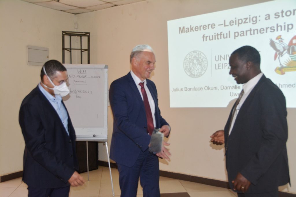 Prof. Robert Tweyongyere (Right) receives a gift from Prof. Uwe Truwen (Centre) and Porf. Ahmed Abd Ai Wahed (Left). 