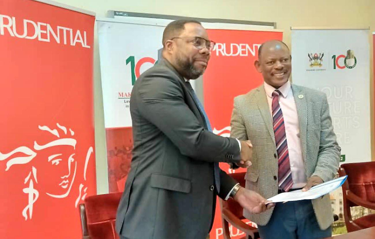 The Vice Chancellor, Prof. Barnabas Nwangwe (Right) shakes hands with Mr. Tetteh Ayitevie, the CEO of Prudential Assurance after the MoU signing on 21st October 2022 at Makerere University.
