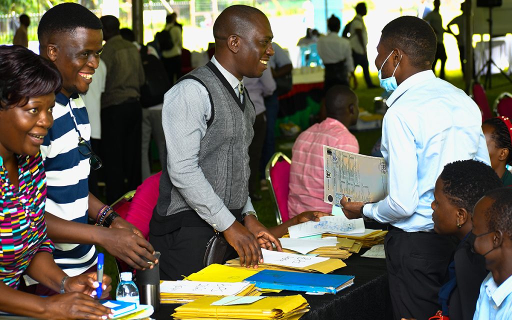 Staff from the College of Business and Management Sciences (CoBAMS) interface with students on the first day of the Public Fair.