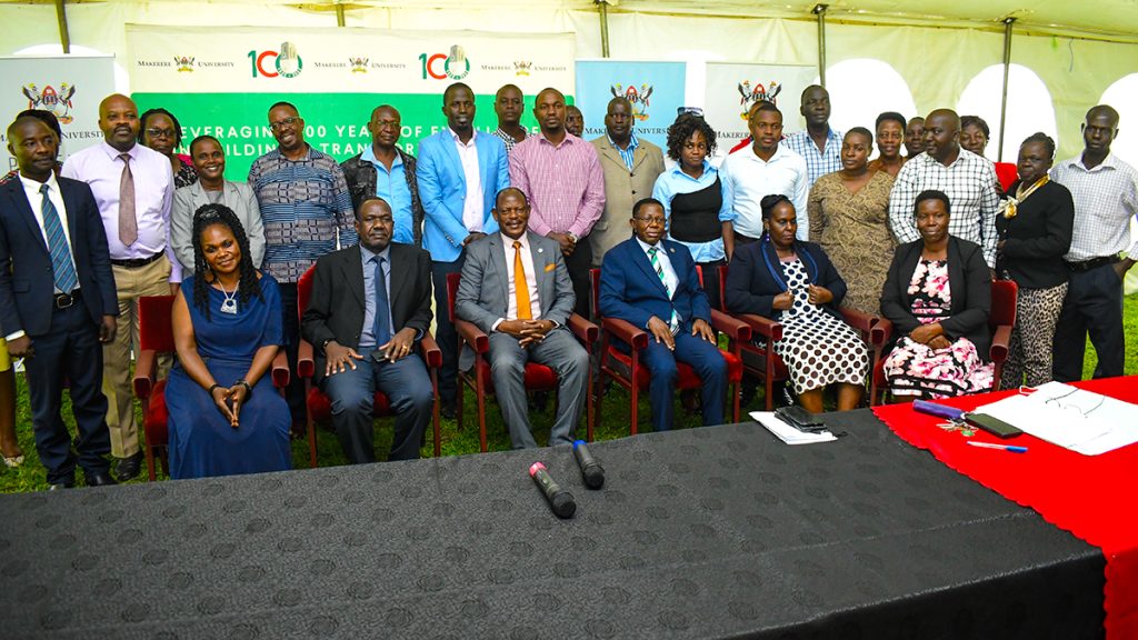 Prof. Barnabas Nawangwe (3rd L), Prof. Buyinza Mukadasi (3rd Right) and Mr. Otim Lynd Tom (2nd L) with members of the Interdepartmental Task Force Tracer Process to Address all Outstanding Transcripts Issues at Makerere University and College Registrars at the Press Conference.