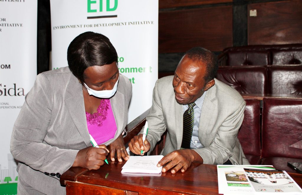Maria Lubega (Left) interacts with the opinion leader Frank Kawooya (Right).