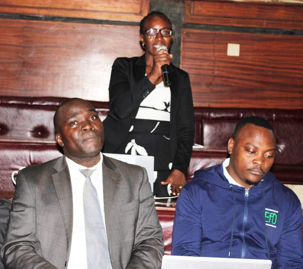 EfD-Mak centre research fellows Dr. John Sseruyange (Left), Dr. Alice Turinawe (Standing) and Fred Kasalirwe during the meeting.