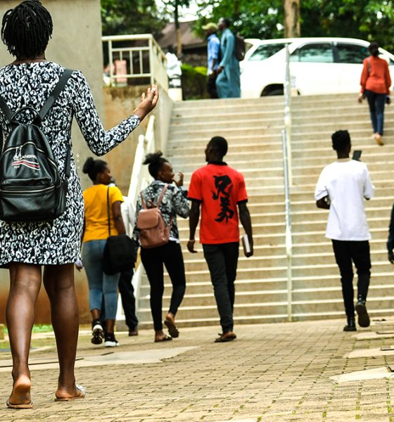 Students stroll past the Frank Kalimuzo Central Teaching Facility-CTF (Left) and School of Social Sciences (Right) on the Makerere University Main Campus. Kampala Uganda, East Africa.