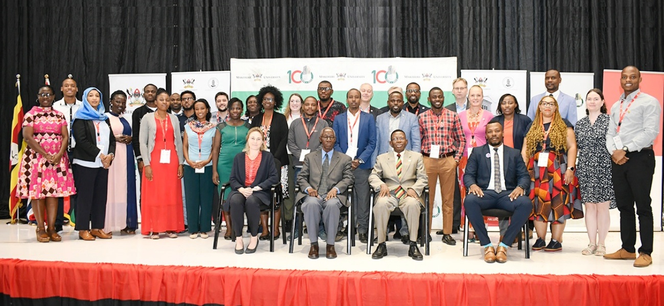 Seated: Former Vice Chancellor Prof. Livingstone Luboobi (2nd Left), Prof. Buyinza Mukadasi - Mak Academic Registrar (2nd Right), Dr. Lwando Mdleleni - Researcher, University of the Western Cape (Right), together with students participating in the Research School at the Yusuf Lule Central Teaching Facility Auditorium on 28th November 2022.