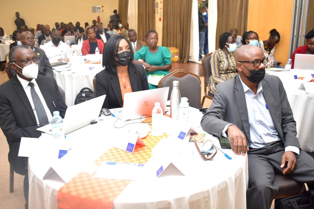 Prof. Samuel Kyamanywa (Left) together with other participants listening to the keynote speeches.