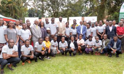 Scholars posing in a group photo with the offcials at the end of the luncheon on 29th November 2022, Makerere University Guest House.