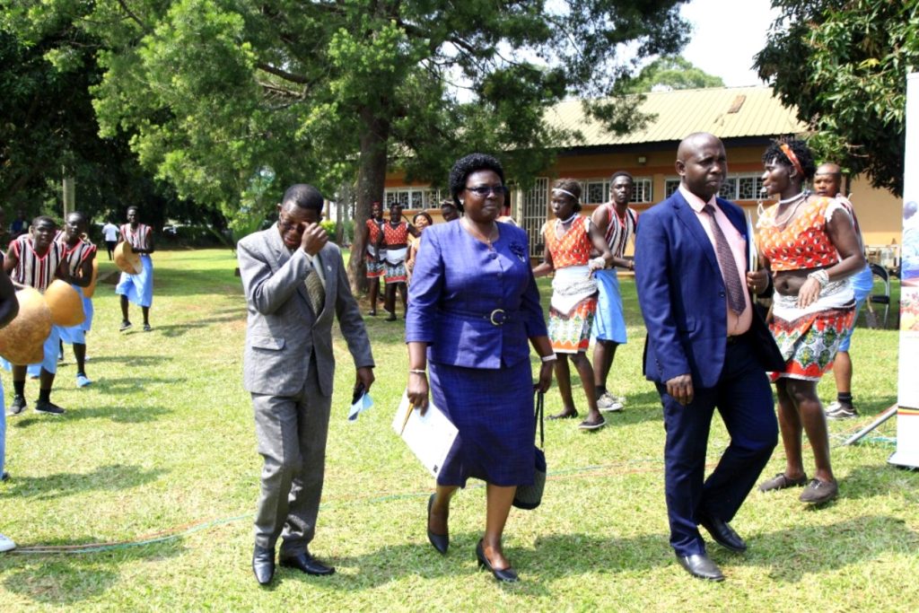 Hon. Dr. Mary Goretti Kitutu (C) is received upon arrival at CAEC, MUARIK by  Prof. Buyinza Mukadasi (L) and the Dean, School of Agricultural Sciences, CAES, Assoc. Prof. John Baptist Tumuhairwe.