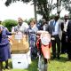 Hon. Grace Freedom Kwiyucwiny (L) hands over some of the donated items to the district officials as Prof. Buyinza Mukadasi (2nd L) and other officials witness on 27th January 2023 at CAEC, MUARIK, Makerere University.