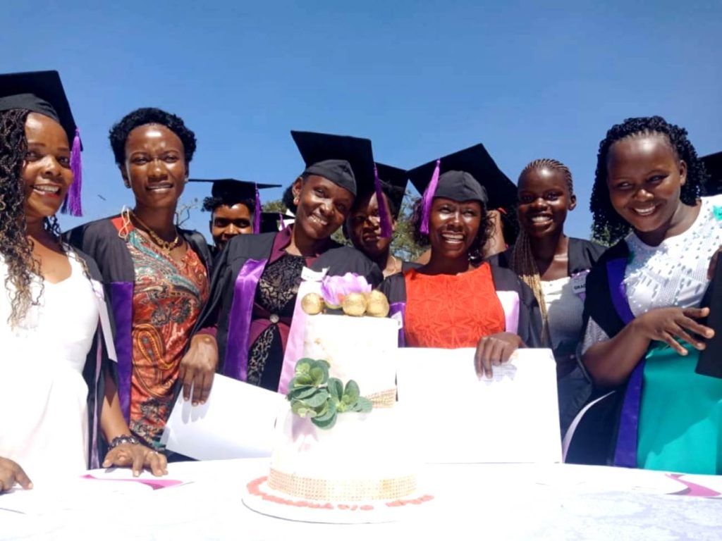 Some of the female graduands smile for the camera the event.