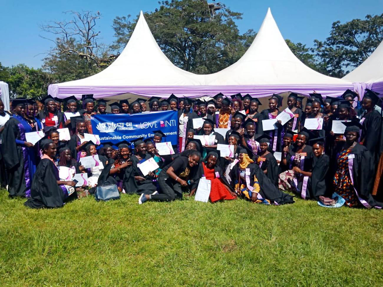 Some of the 417 graduands of the Love Binti International certificate program pose with their certificates at Freedom Square, Makerere University on 7th January 2023.