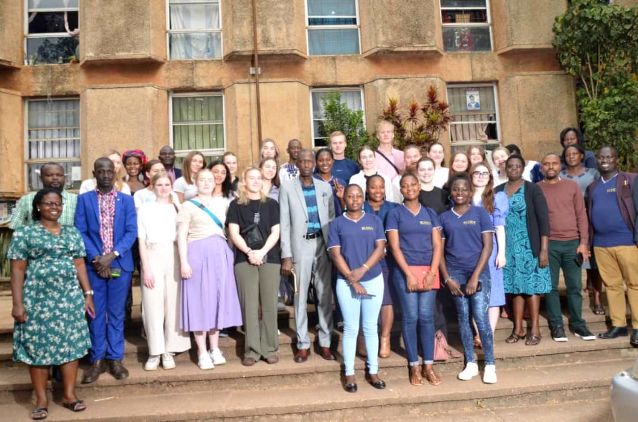 The Principal CEES-Prof. Anthony Muwagga Mugagga (Centre grey suit), Coordinator of the Student Exchange Program-Mr. Joseph Watuleke (Right), Staff and Students from CEES and the University of Agder, Norway pose for a group photo on 9th January 2023 at Makerere University.