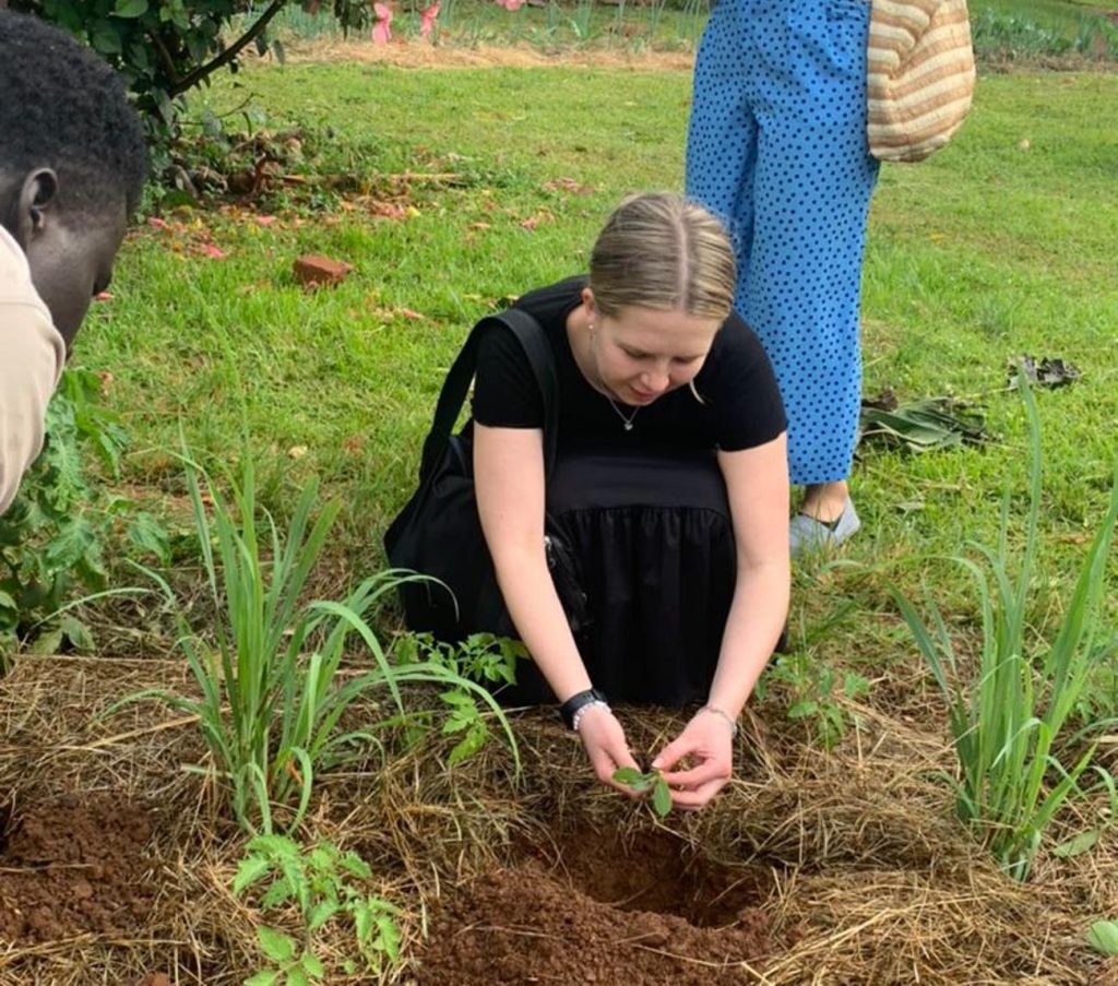 Students transplant seedlings during their visit.