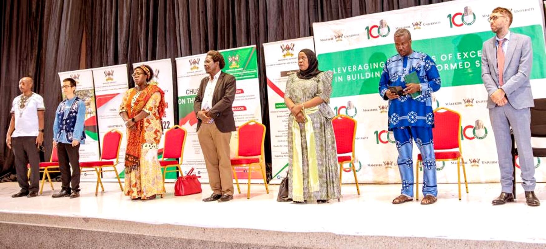 The CHUSS Leadership and Partners pose for a group photo during the opening session of the School of Languages, Literature and Communication Open Day on 9th December 2022, Yusuf Lule Auditorium, Makerere University.