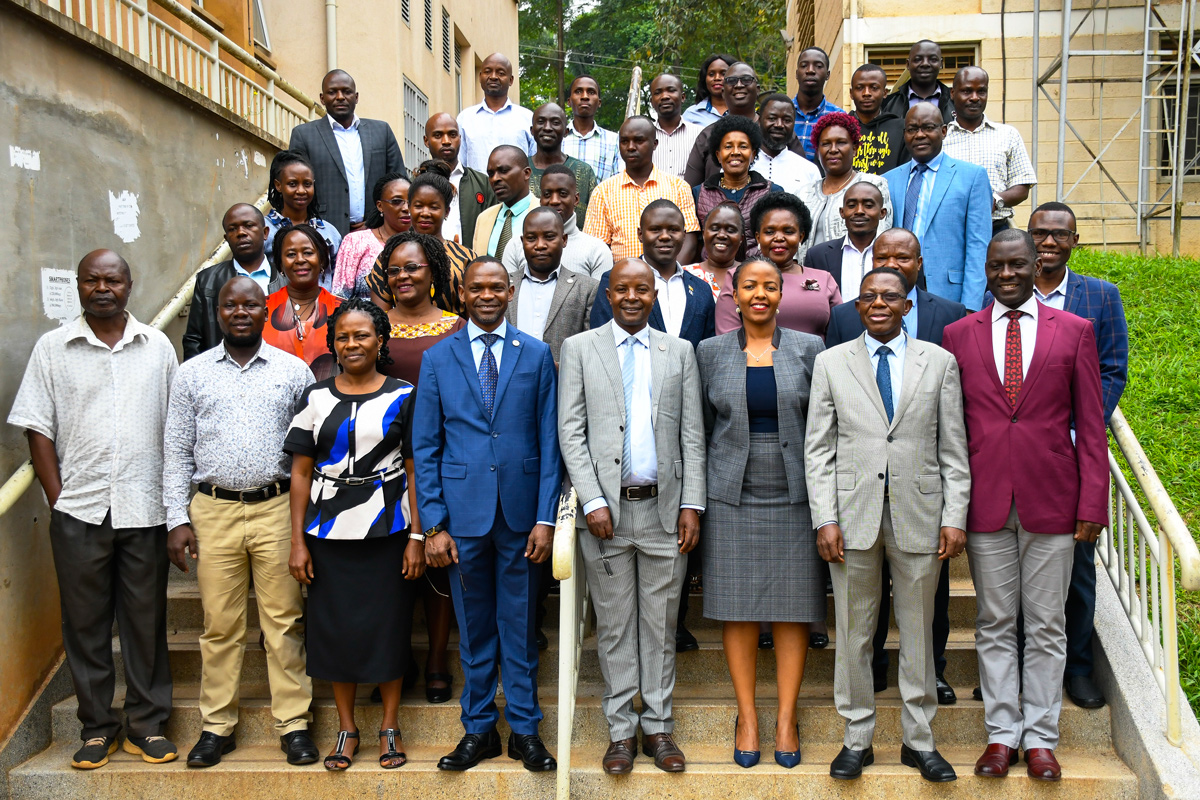 Front Row: DVCAA-Prof. Umar Kakumba (4th L), Director DRGT-Prof. Edward Bbaale (4th R), Academic Registrar-Prof. Buyinza Mukadasi (2nd R) and Prof. Julius Kikooma (R) with Early-Career fellows and participants at the SECA Project Final Dissemination Workshop on 12th January 2022, Makerere University.