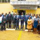 Government Chief Whip Hon. Hamson Obua (in a yellow tie) flanked by Vice Chancellor Prof. Barnabas Nawangwe (on his left) and Prof. Edward Bbaale (on his right) join Members of Management and leadership the PhD Fellows after the opening ceremony of the Annual Doctoral Convention 2023 held at the Yusuf Lule Auditorium on 28th February 2023.