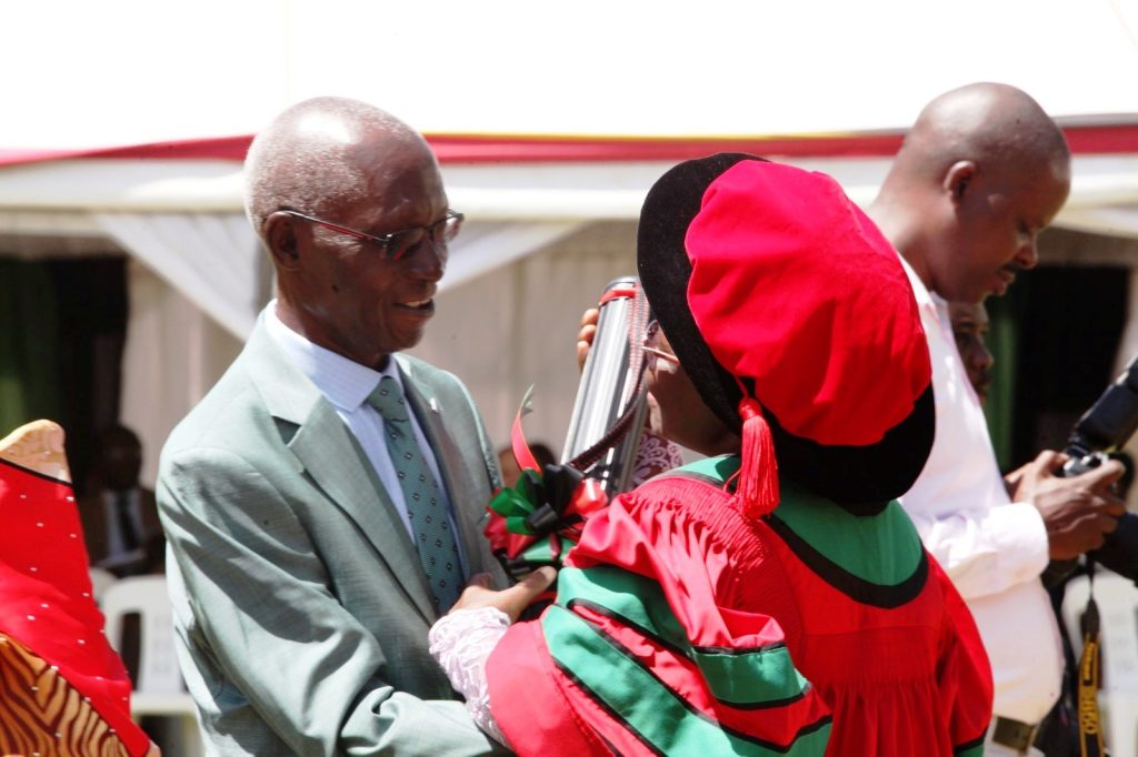 Former Vice Chancellor, Prof. Livingstone Luboobi congratulating Dr. Nankinga.