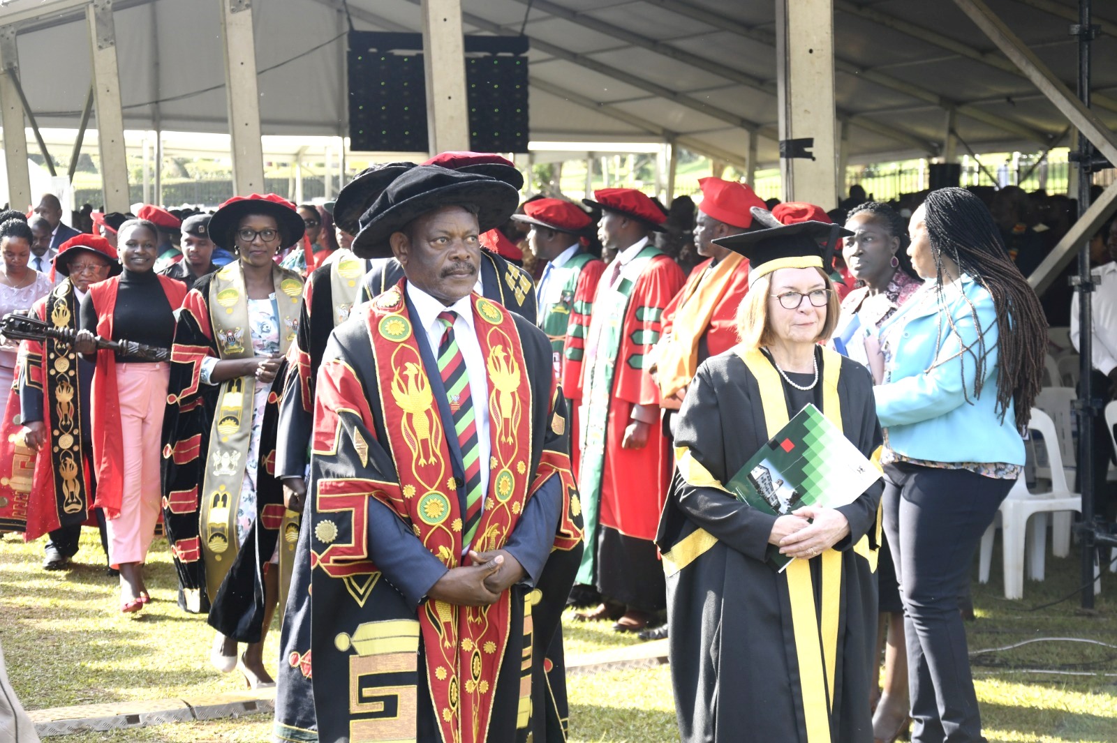 The Vice Chancellor, Prof. Barnabas Nawangwe (2nd R) and Vice-Chancellor University of London, Prof. Wendy Thomson (R) with members of the University leadership as the Procession makes its way through the Freedom Square on Day 1 of the 73rd Graduation Ceremony on 13th February 2022.
