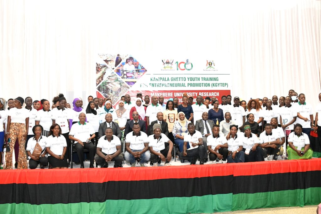 The 50 Ghetto Youth set to benefit from KGYTEP pose for a group photo with officials at the launch. 