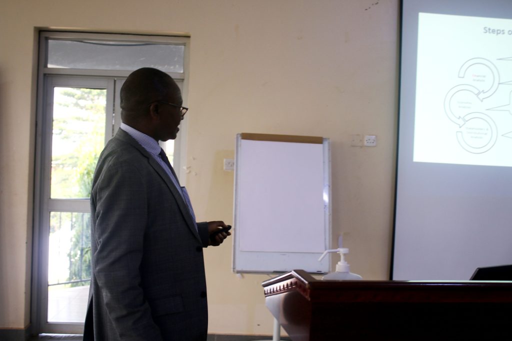 The Manager, Public Investment Management (PIM) Centre of Excellence Dr. Willy Kagarura conducts one of the training sessions.