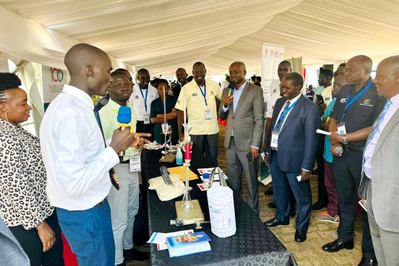 Project Team pitching the innovation to Hon. Silas Aogon (in a grey suit speaking on the microphone), Uganda’s Member of Parliament for Kumi Municipality, Kumi District and Chairperson Water Sanitation and Hygiene (WASH) Parliamentary Committee. Photo Credit: Harriet Adong, Mak-RIF