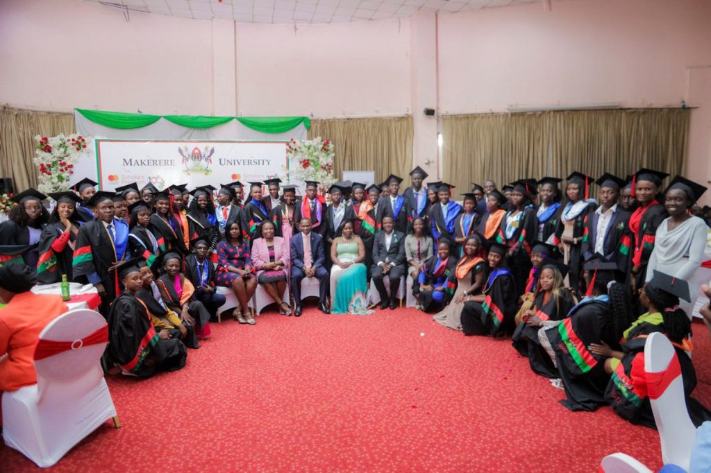 A Cross-section of Mastercard Foundation Scholars pose for a group photograph with officials during the event.