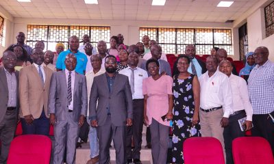 Prof. Edward Bbaale (3rd Left) flanked by Assoc. Prof. Robert Wamala (on his right) and Assoc. Prof. Julius Kikooma (on his left) join other MUBS Staff in a group photo on 23rd February 2023 in the ADB Theatre II.