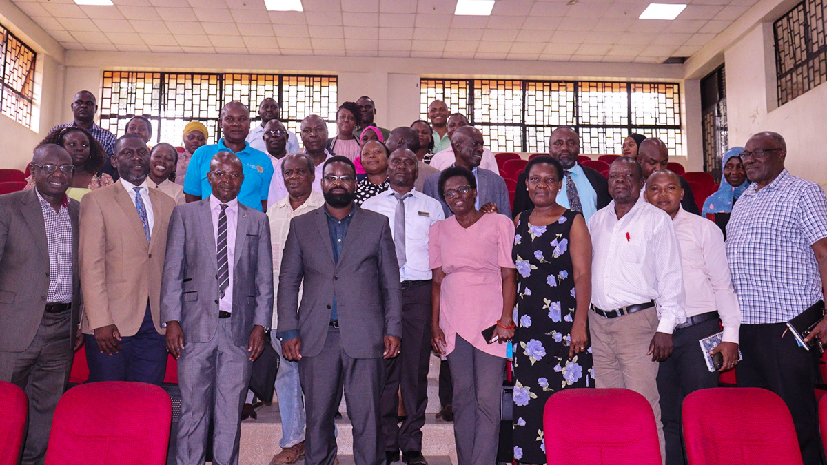 Prof. Edward Bbaale (3rd Left) flanked by Assoc. Prof. Robert Wamala (on his right) and Assoc. Prof. Julius Kikooma (on his left) join other MUBS Staff in a group photo on 23rd February 2023 in the ADB Theatre II.