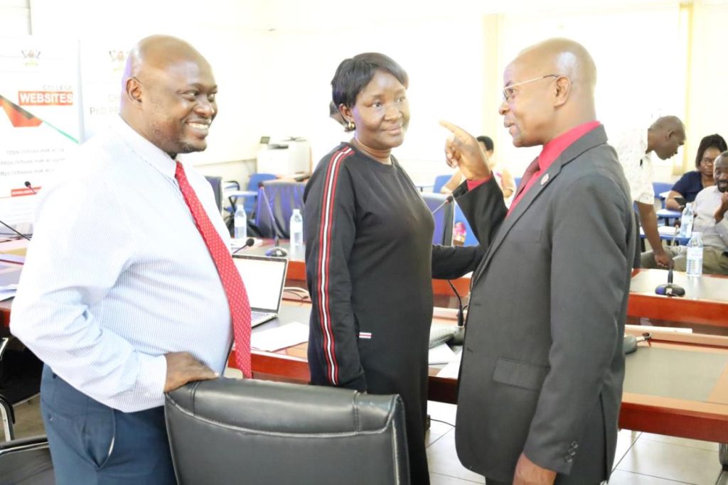 The Deputy Principal CHUSS Assoc. Prof. Erich Awich Ochen (Left) and Dean School of Pyschology Assoc. Prof. Grace Kibanja (Centre) interact with Prof. Edward Bbaale (Right).