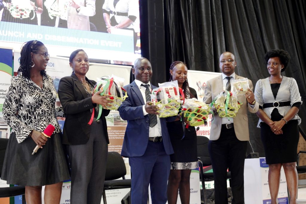 On behalf of the Minister, Mr. Tom Mukasa Bukenya (3rd Left) launched the products made under the project.