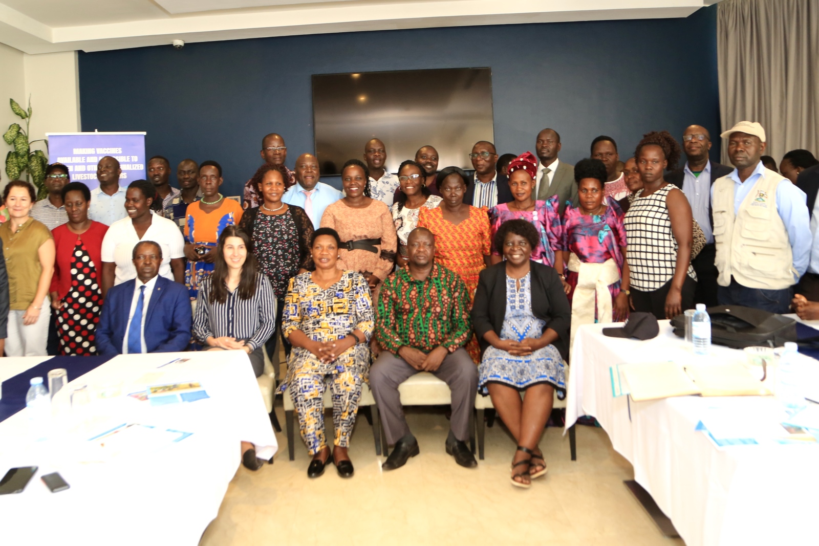 Participants including Hon. Janet Akech Okori-moe (Seated C), Prof. William Bazeyo (Seated L) that attended the Livestock Vaccine Innovation Fund (LVIF) project multi-stakeholders meeting convened at Golden Tulip Hotel, Kampala, Uganda on Monday 5th March 2023 pose for a group photo.