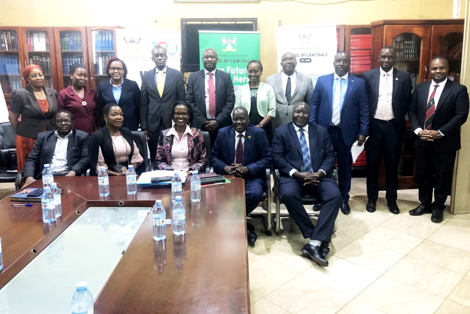 Front Row: The Chairperson, Mrs. Lorna Magara (C), Deputy Chairperson, Rt. Hon. Daniel Fred Kidega (2nd L), Ag. Principal, Prof. Ronald Naluwairo (R) with Members of Council and SoL Managers during the visit on 27th February 2023.