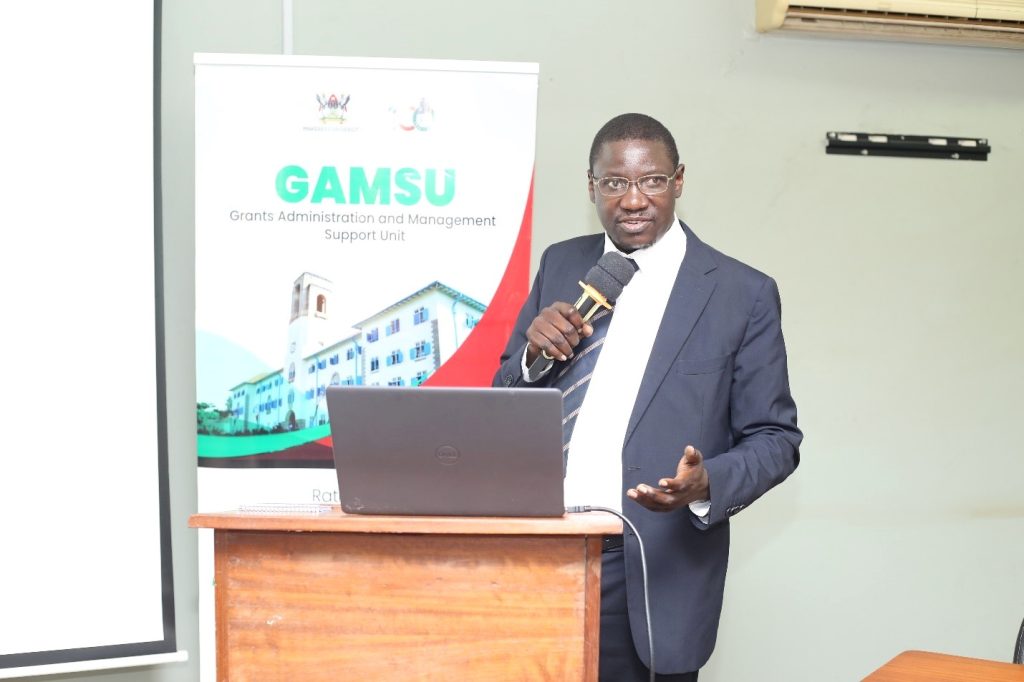 Dr. Cyprian Misinde, Director of the Quality Assurance Directorate (QAD), addressing participants at the GAMSU workshop.