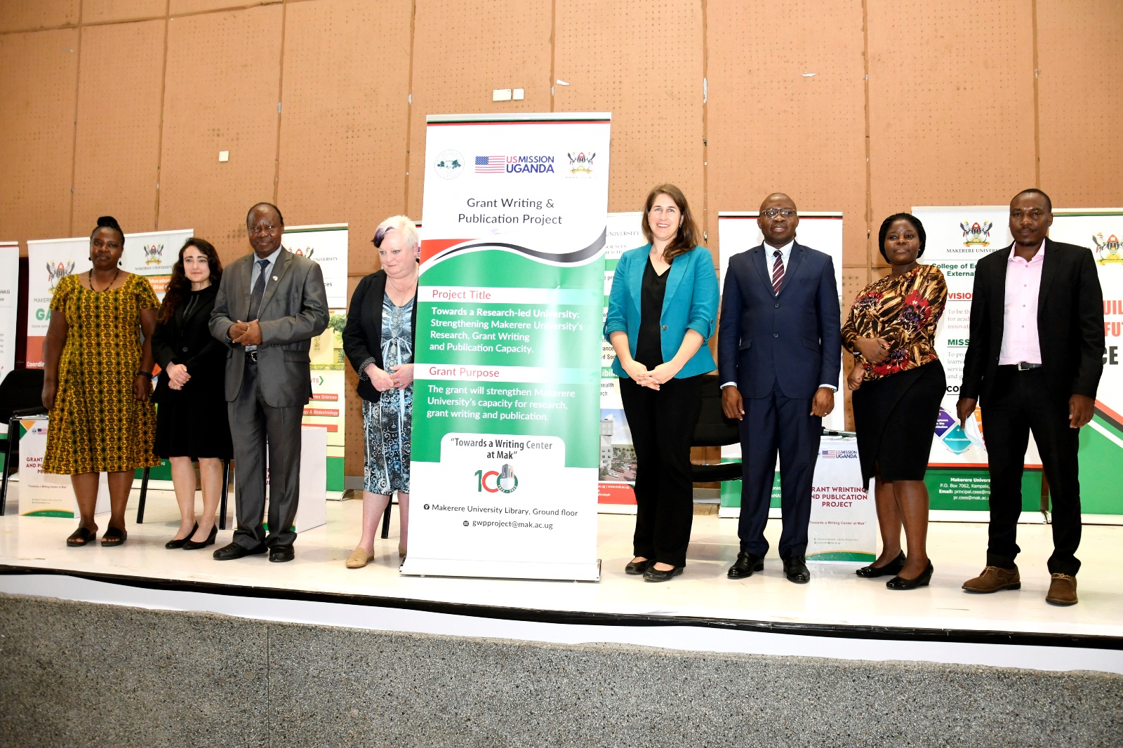 Amy Peterson, Cultural Affairs Officer the US Embassy Kampala (4th R) with Co-PIs; Prof. Fredrick J. Muyodi (3rd L), Prof. Trixie G. Smith (4th L), Prof. Ronald Bisaso (3rd R), Ms. Stella Kakeeto (2nd R), Dr. Grace Pregent (2nd L), and Members of Management; Prof. Ireeta Tumps (R) and Dr. Euzobia Mugisha Baine (L) at the Project Launch on 21st March 2023, Yusuf Lule Auditorium, Makerere University.