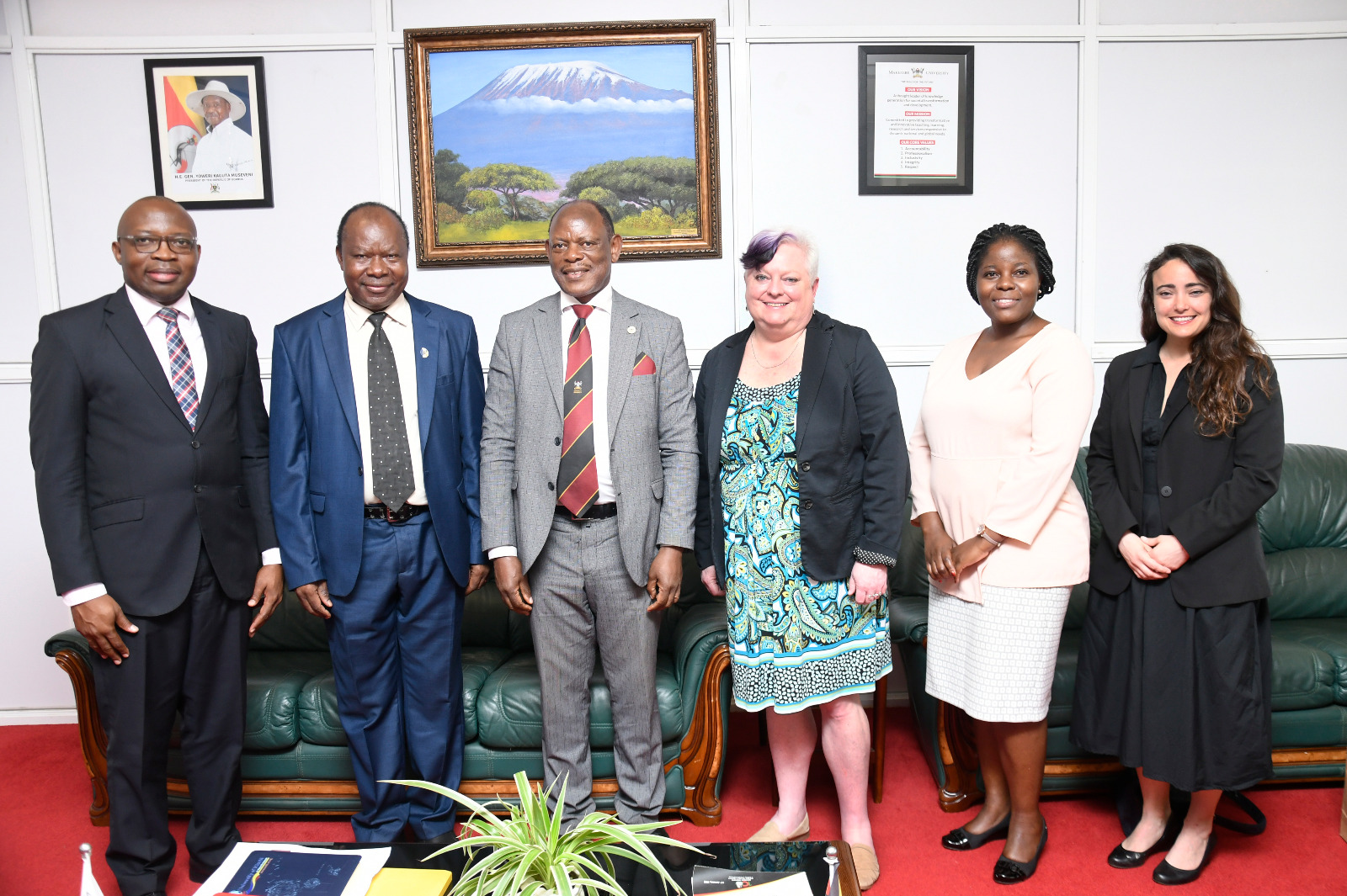 The Vice Chancellor, Prof. Barnabas Nawangwe (3rd L) with the project team, Prof. Trixie G. Smith (3rd R), Prof. Fredrick Muyodi (2nd L), Dr Grace Pregent (R), Prof. Ronald Bisaso (L), and Ms. Stella Kakeeto (2nd R) after the meeting on 20th March 2023, Frank Kalimuzo Central Teaching Facility, Makerere University.