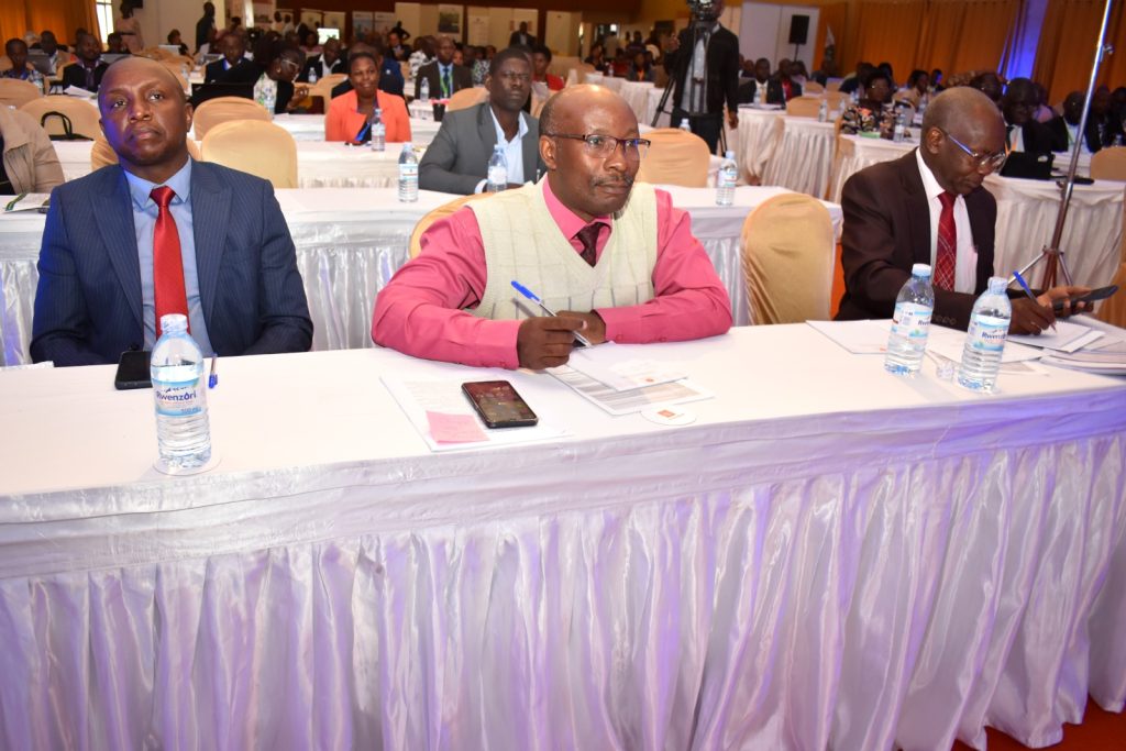 Prof. Arthur Tugume (C), Dean School of Biosciences at the College of Natural Sciences with Prof. Bernard Bashaasha (R), and Mr. Collin Babirukamu, Director E-government Services, NITA-U (L) at the conference.