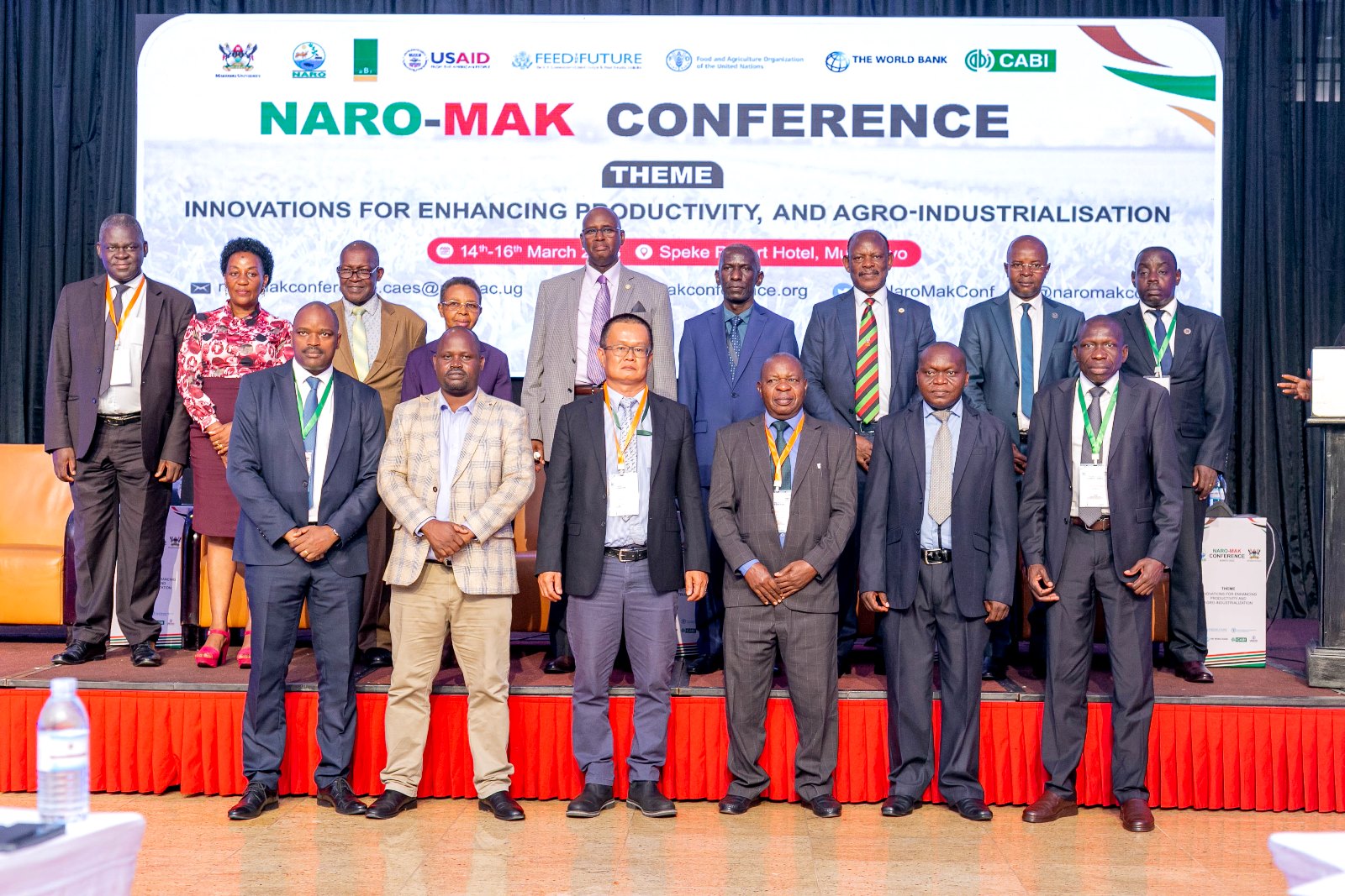 The Minister of State for Animal Industry, Hon. Bright Rwamirama (C-back row); the Vice Chancellor, Makerere University, Prof. Barnabas Nawangwe (3rd R - back row); the Director DRGT, Prof. Edward Bbaale (2nd R back row); the Principal of CAES, Prof. Gorettie Nabanoga (2nd L back row); the Chair NARO Council, Dr William Olaho Mukani (3rd L back row); and the Chair of the Conference Organizing Committee, Dr Imelda N. Kashaija (4th L back row) with some of the presenters at the closing ceremony of the conference held at Speke Resort Munyonyo on 16th March 2023.