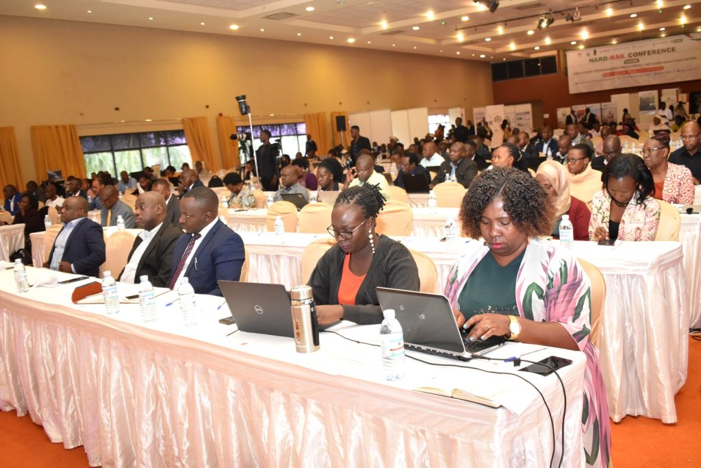 Participants follow the proceedings of the conference.