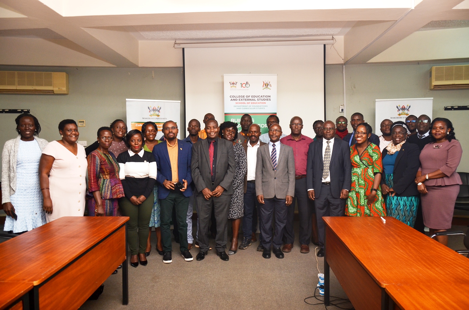 The PI-Dr. Walimbwa Michael (Centre red tie) and Mak-RIF's Dr. Walakira Eddy (Centre stripped tie) with participants at the training workshop on innovative assessments on 15th March 2023, Telepresence Centre, Senate Building, Makerere University.