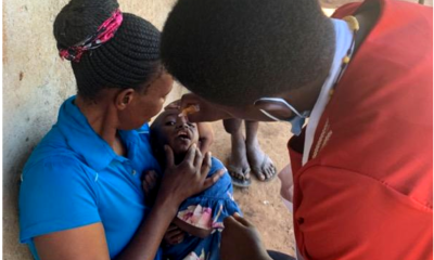 A female child receives an oral vaccine. Photo: DHPI-R.