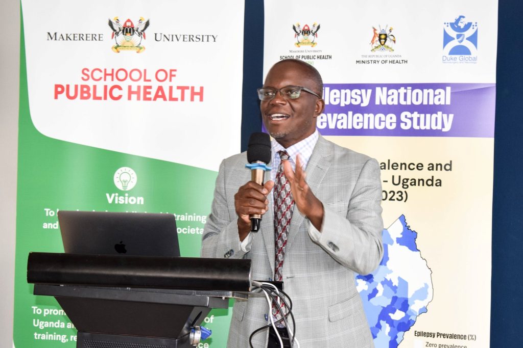 Dr. Fredrick E Makumbi, Associate Professor and a Ugandan Principal Investigator speaking at the dissemination meeting.