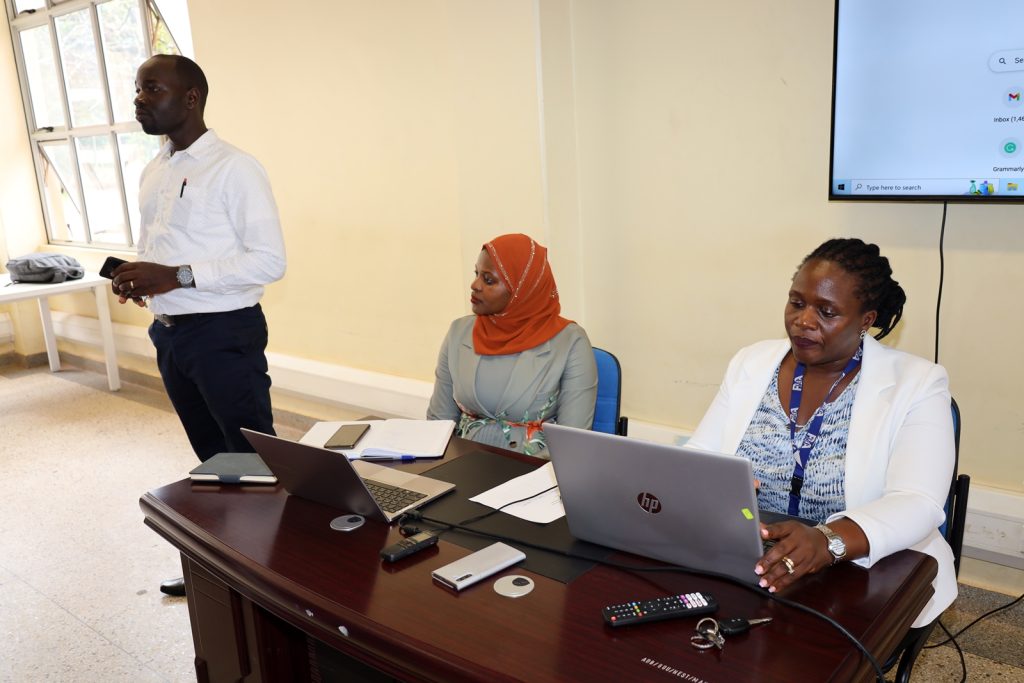 Dr. Christopher Alioni (Left) with the two trainers from PPDA (seated) during the training.