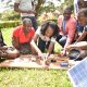 Female and Male participants engaged in a practical session during the 8th Training Workshop in Solar Photovoltaic Installation and Maintenance, Biogas Production and Solar Thermal Systems held in May 2022 at the Department of Physics, Makerere University, Kampala Uganda.